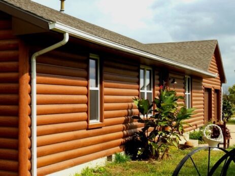 house done in rounded log siding look