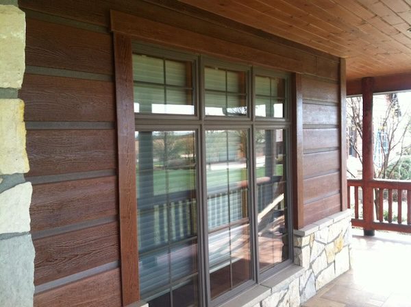 up close of timber with chinking look and trim around door